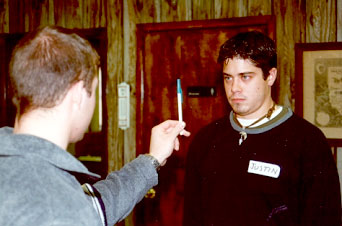 Male Student giving a field sobriety test to a male volunteer