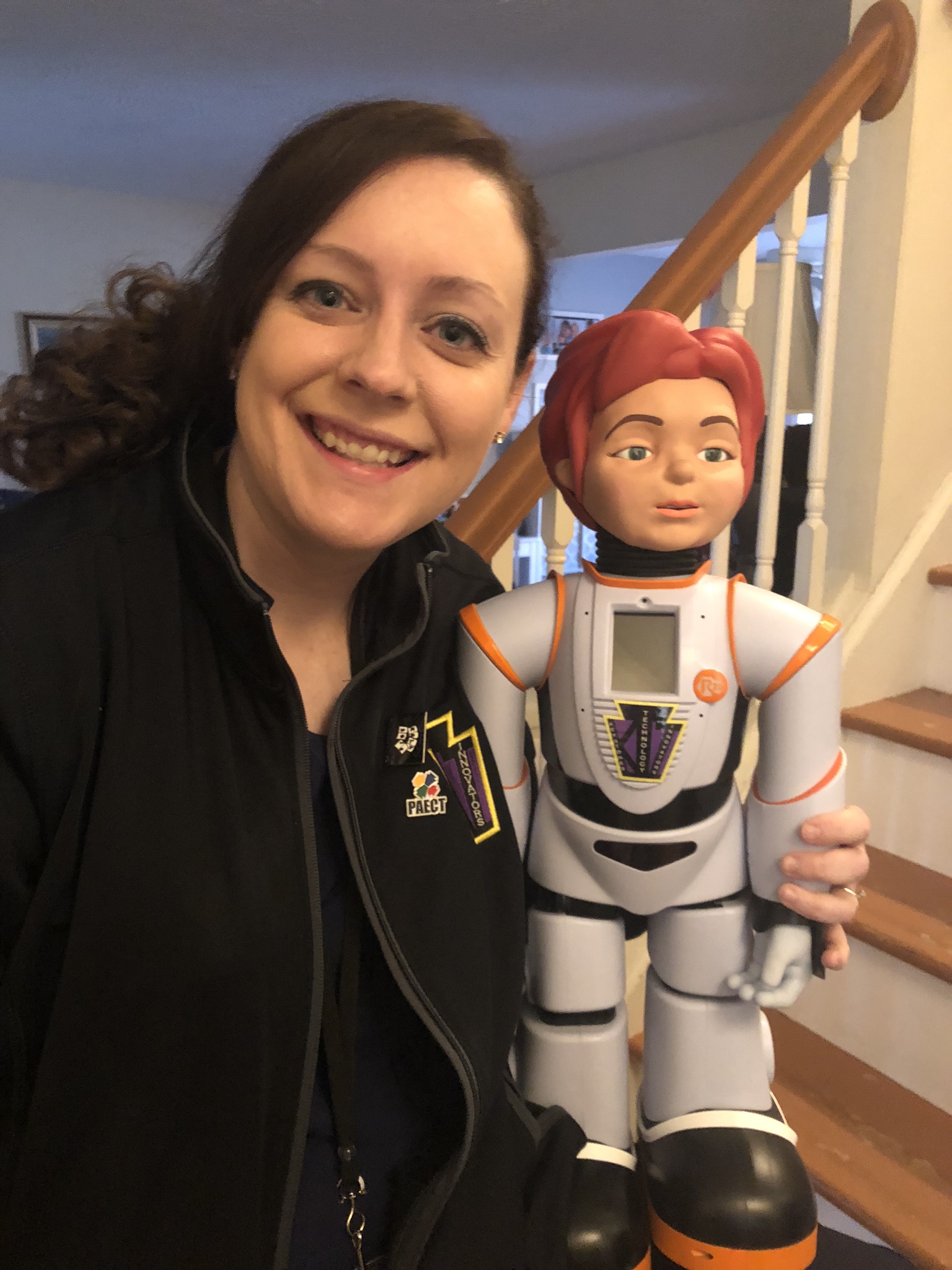 Dr. Redcay posing with the femaile humanoid named Robon.